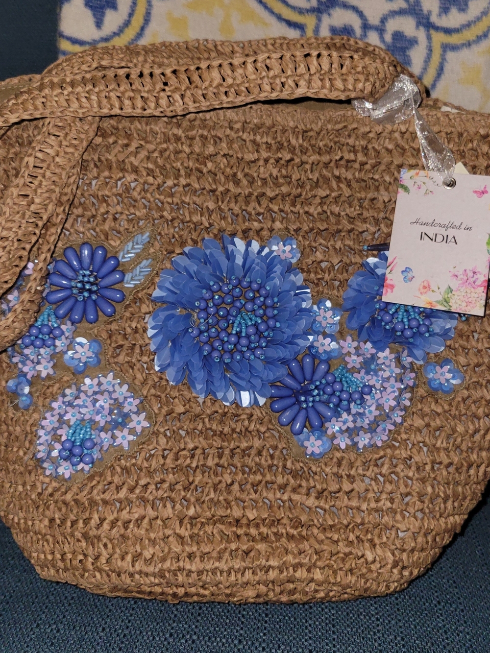 Handcrafted Tan Straw Tote with Blue Floral Appliqué